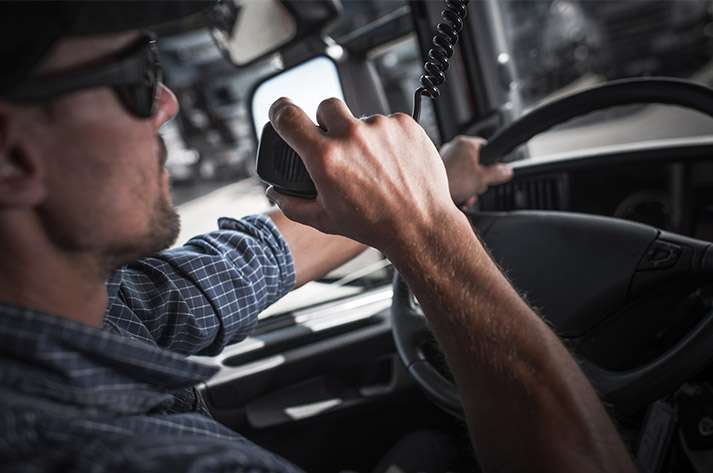Trucker using hand-held radio